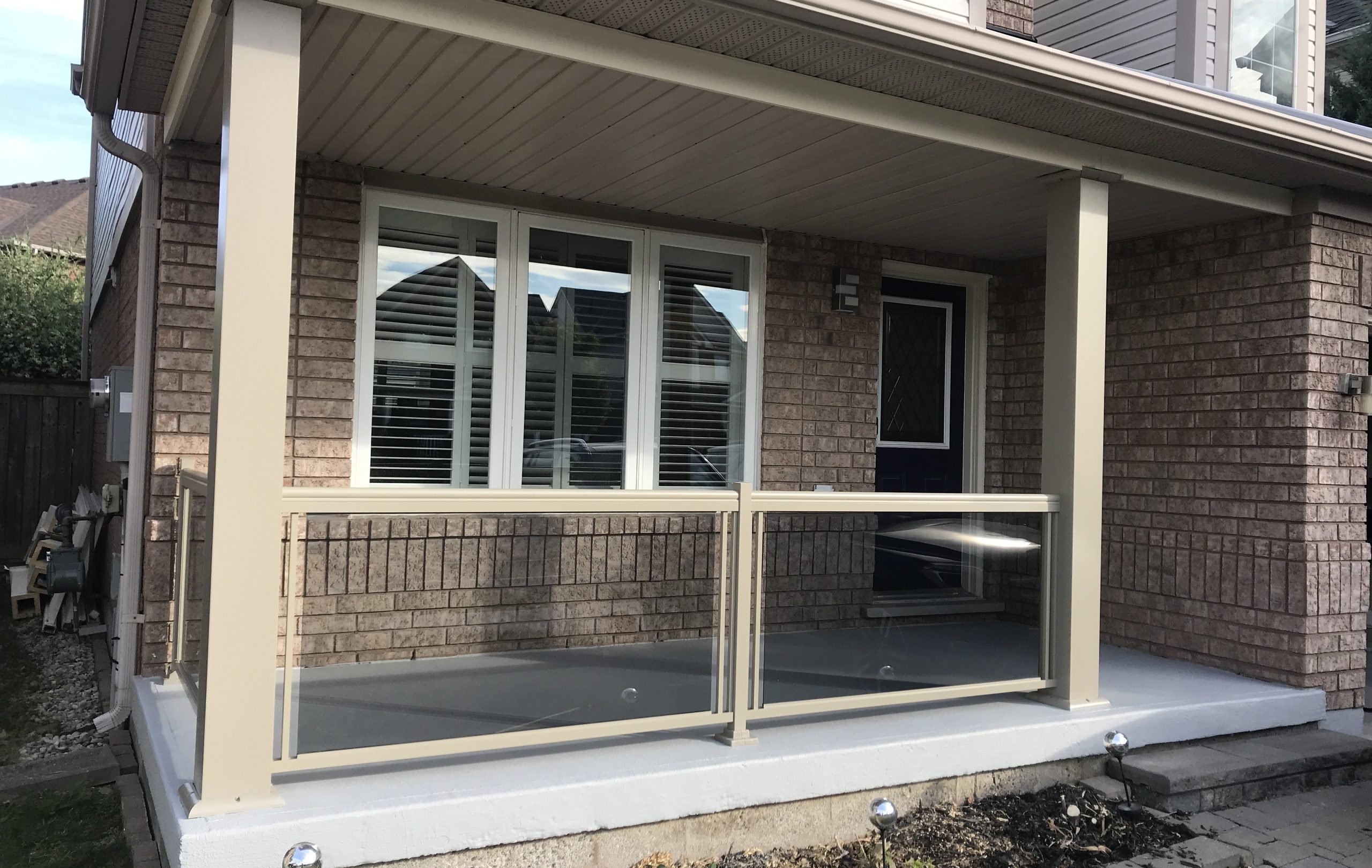 Concrete Porch Repair and Renovation with Tinted Grey Glass Railings Kitchener, ON